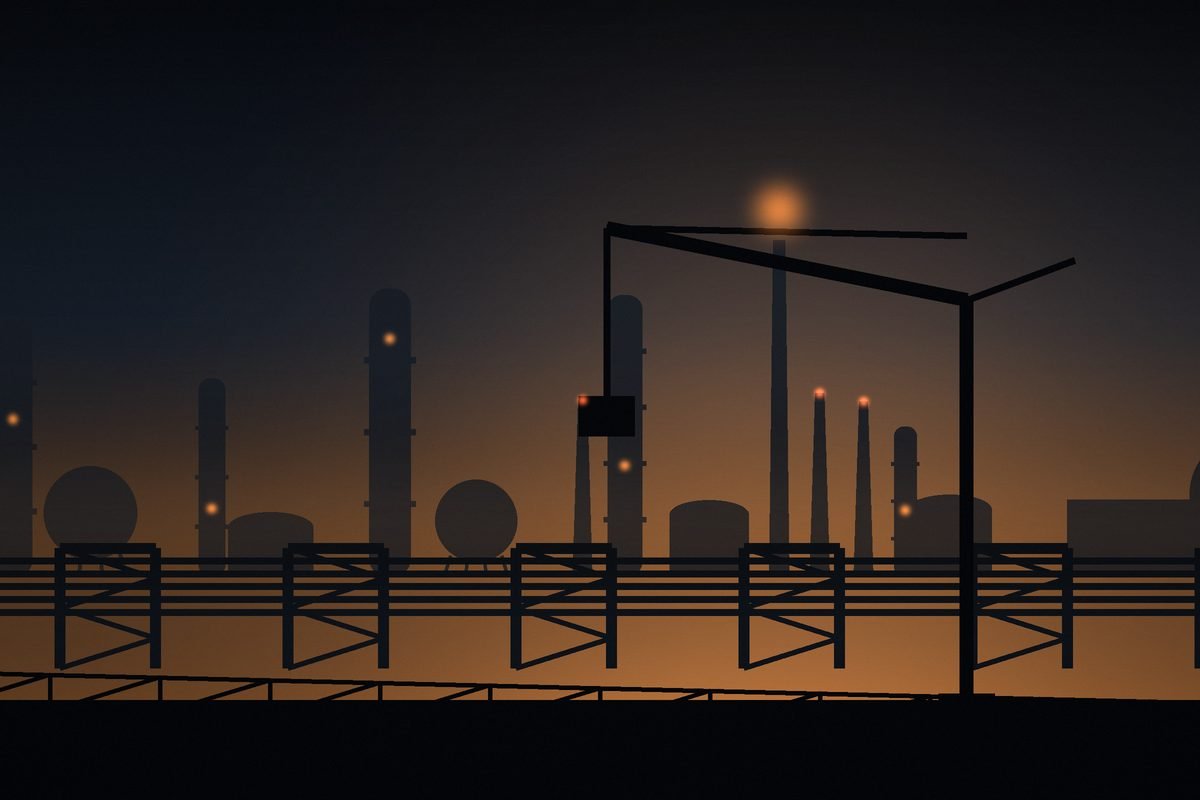 Industrial site at dusk with a tower crane over the plant