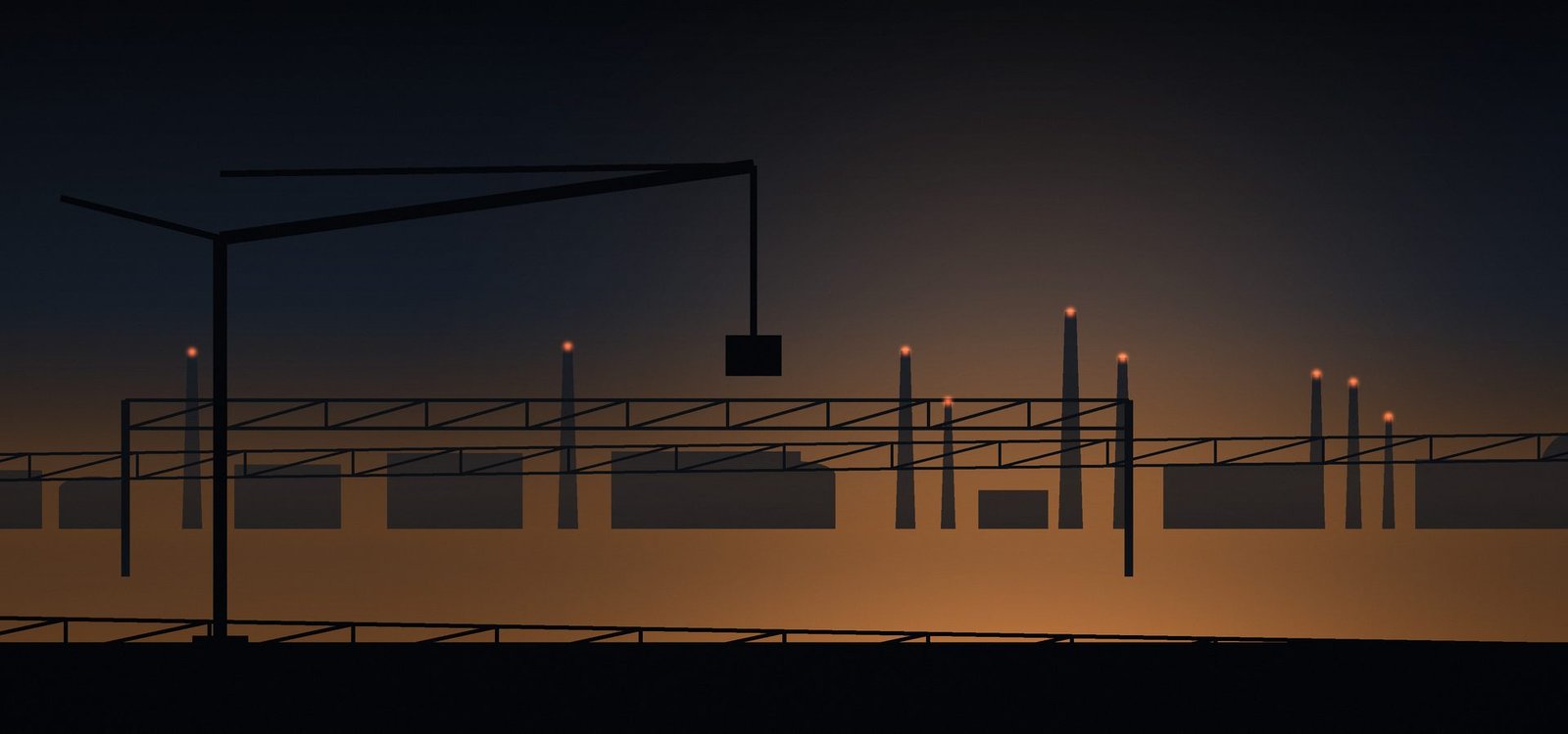 Steel plant silhouetted against an evening sky